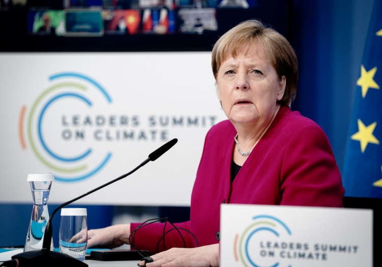 Angela Merkel speaking at a podium during a public inquiry on Wirecard lobbying - Global Banking & Finance Review