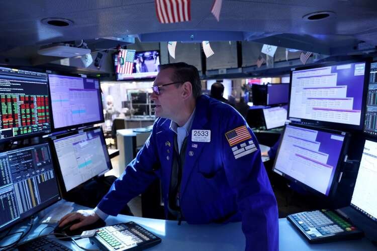 A trader works on the trading floor at the New York Stock Exchange (NYSE) in Manhattan, New York City