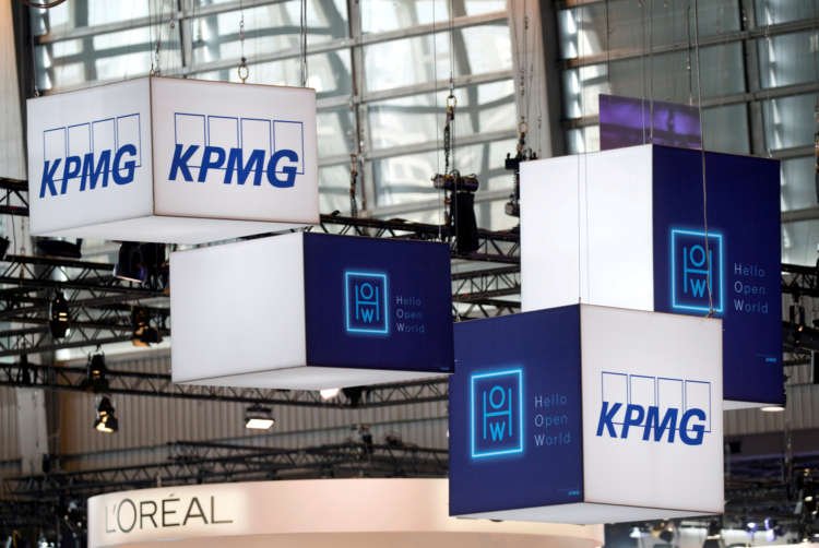 KPMG UK employees working in modern office environment - Global Banking & Finance Review