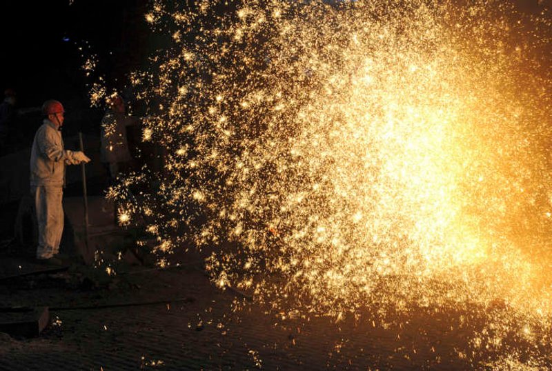 Image for China’s factory output slows as bottlenecks crimp production