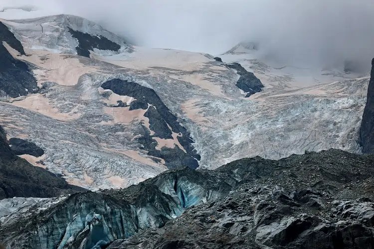Aerial view of Swiss glaciers representing climate change impacts - Global Banking & Finance Review