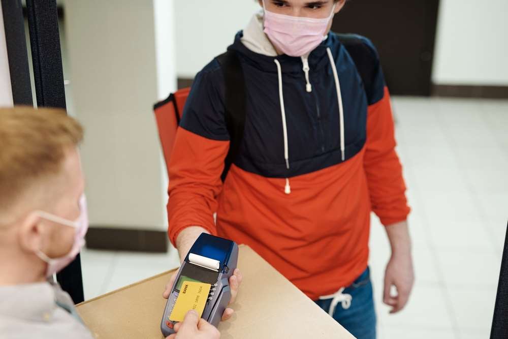 Busy urban street with people, symbolizing the post-pandemic shift in payments - Global Banking & Finance Review