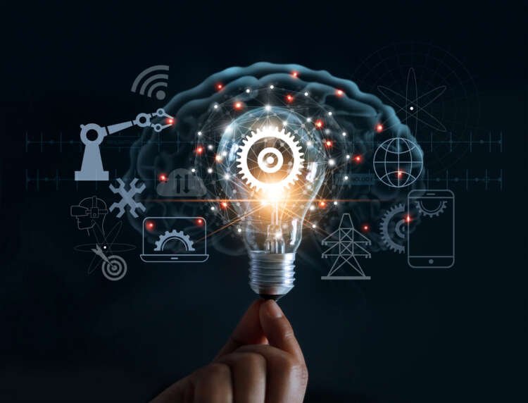 Hand holding light bulb and cog inside and innovation icon network connection on brain background, innovative technology in science and industrial concept