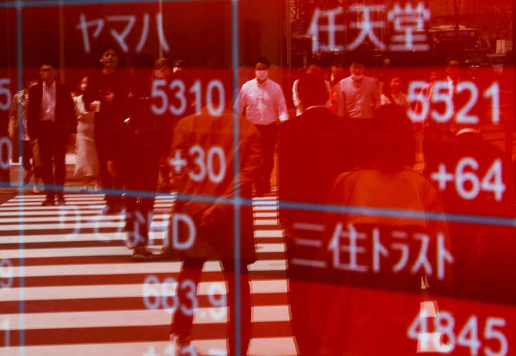 Stock market fluctuations reflected in Tokyo's stock quotation board - Global Banking & Finance Review