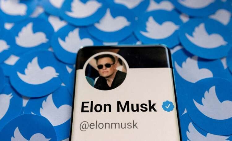 Elon Musk's Twitter profile on a smartphone with Twitter logos - Global Banking & Finance Review