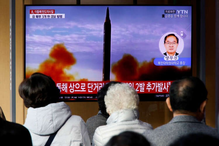 People watch a news report on North Korea's artillery fire into the sea - Global Banking & Finance Review