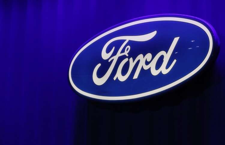 Ford Motor Company logo with COVID-19 vaccination status announcement - Global Banking & Finance Review