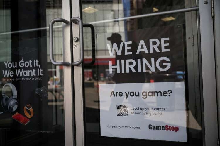 A New York City GameStop storefront displays a hiring sign, reflecting job market dynamics - Global Banking & Finance Review