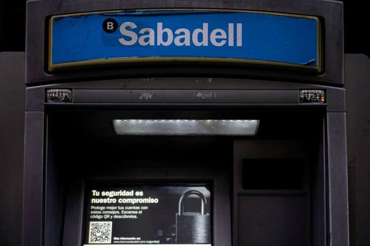 FILE PHOTO: Sabadell bank’s logo is seen at an ATM machine outside one of the bank’s branches in Madrid