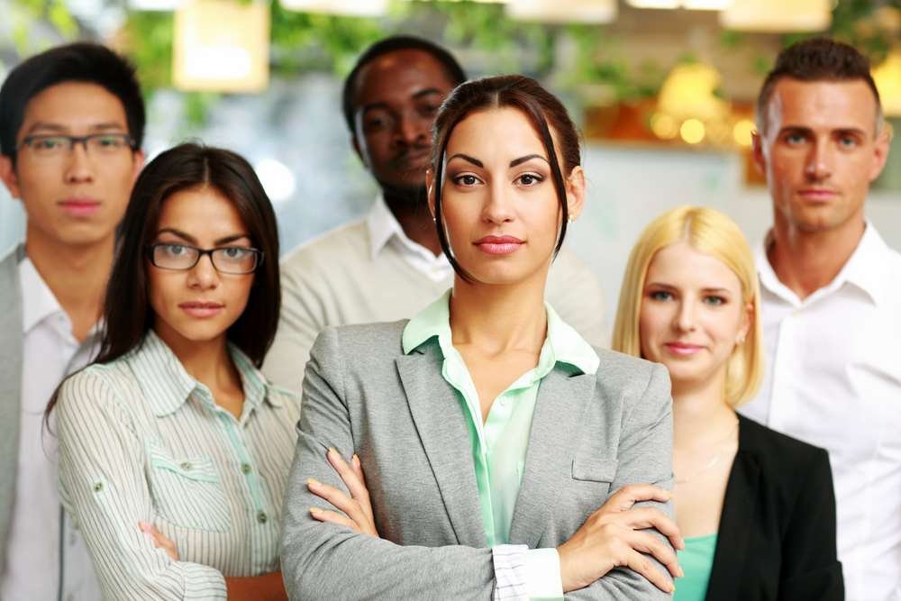 Illustration of AI robots in a workplace, highlighting job displacement concerns - Global Banking & Finance Review