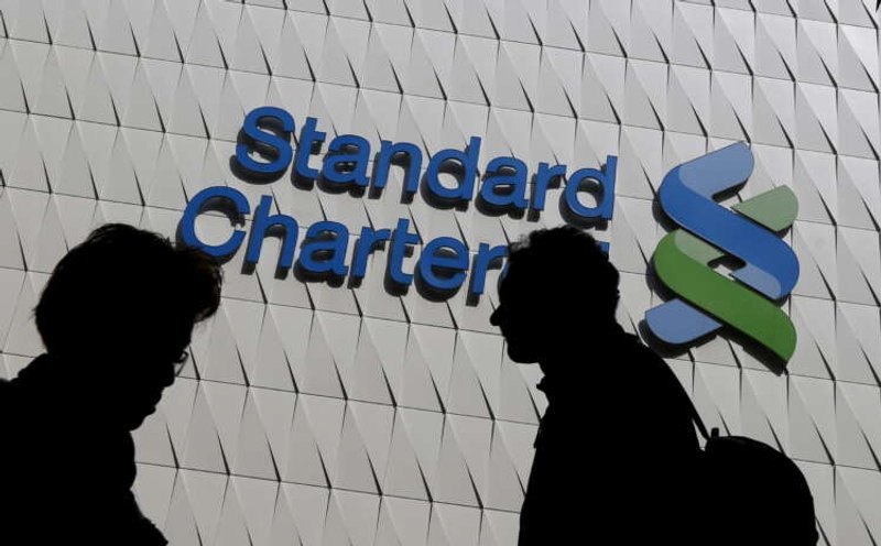 Image for StanChart reinstates payouts but income drop signals challenges ahead