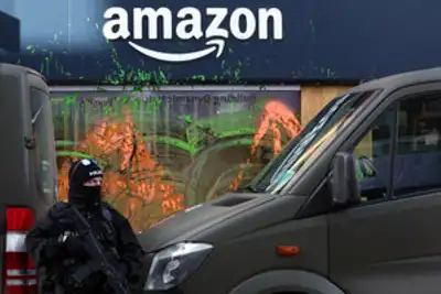Image for Davos climate activists paint Amazon base green, disrupt helicopters