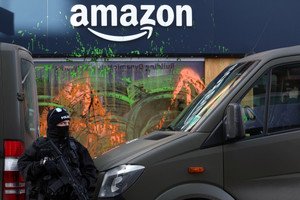 Image for Davos climate activists paint Amazon base green, disrupt helicopters