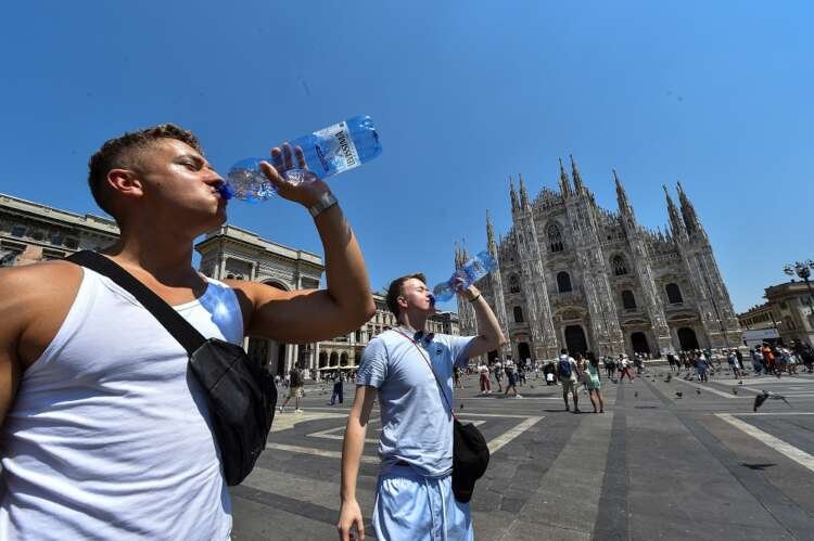 A sun-drenched street in Italy during a summer heatwave - Global Banking & Finance Review