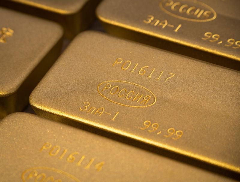 Gold bars stacked with a rising arrow symbolizing bullish trends in gold prices - Global Banking & Finance Review