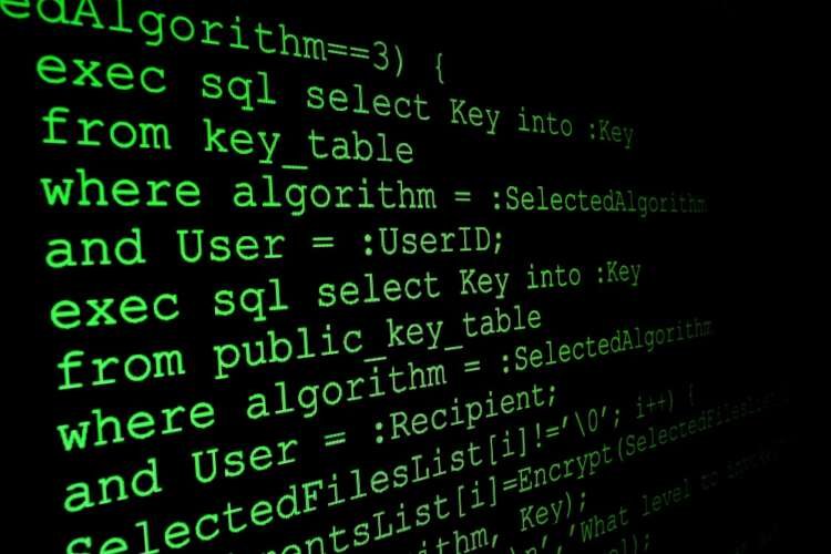 Close-up of program code on a monitor, symbolizing data protection reform in the UK - Global Banking & Finance Review