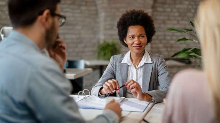 Illustration of a heart symbol intertwined with bank notes, representing romance scams - Global Banking & Finance Review