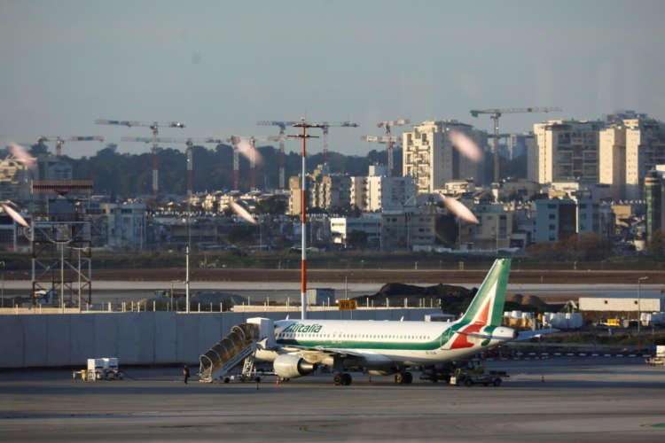 Alitalia plane on tarmac, symbolizing Italy's crucial talks with EU - Global Banking & Finance Review