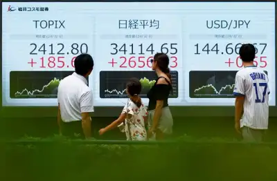 Image for Asian stocks slide as China stimulus disappoints; bitcoin extends record rally