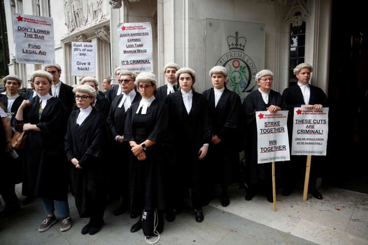 Barristers striking outside the Supreme Court in London over pay dispute - Global Banking & Finance Review