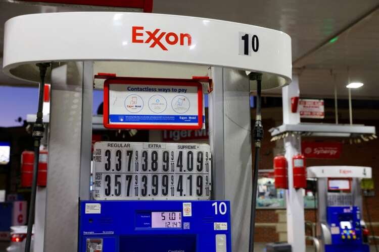Gasoline pump signage at Exxon station, highlighting oil price surge - Global Banking & Finance Review