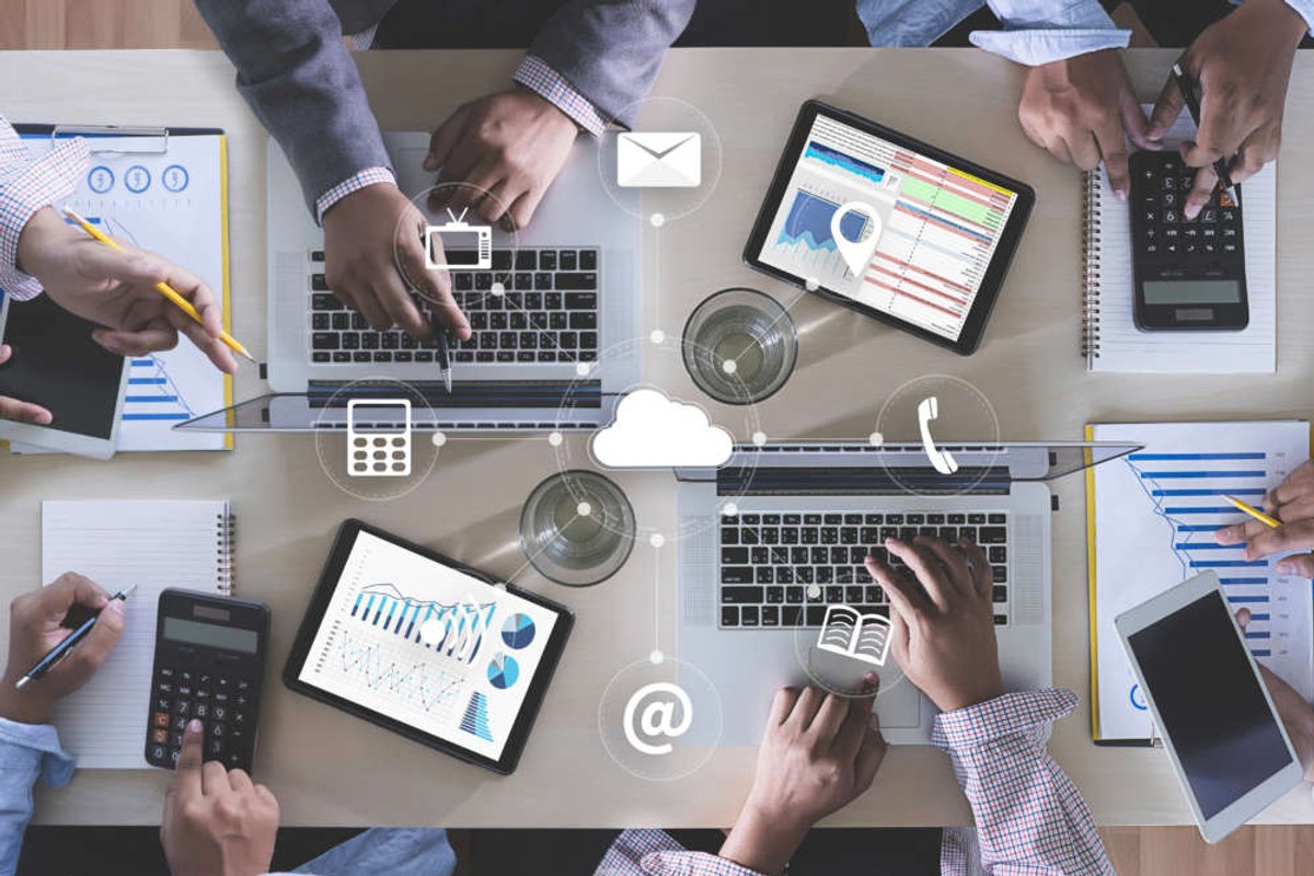 Business professionals analyzing financial reports while planning for Internet outages - Global Banking & Finance Review