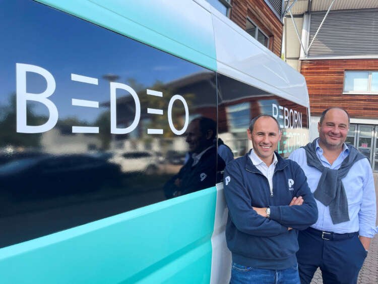 Bedeo CEO Osman Boyner with Protean Electric CEO Andrew Whitehead beside an electric van conversion - Global Banking & Finance Review