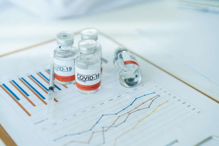 Small business owner assessing financial documents for COVID-19 recovery - Global Banking & Finance Review