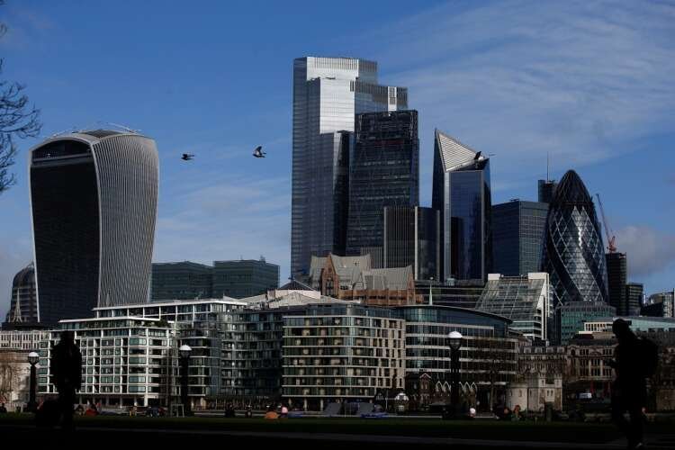 FILE PHOTO: City of London financial district can be seen, whilst British stocks tumble as investors fear that the coronavirus outbreak could stall the global economy, in London
