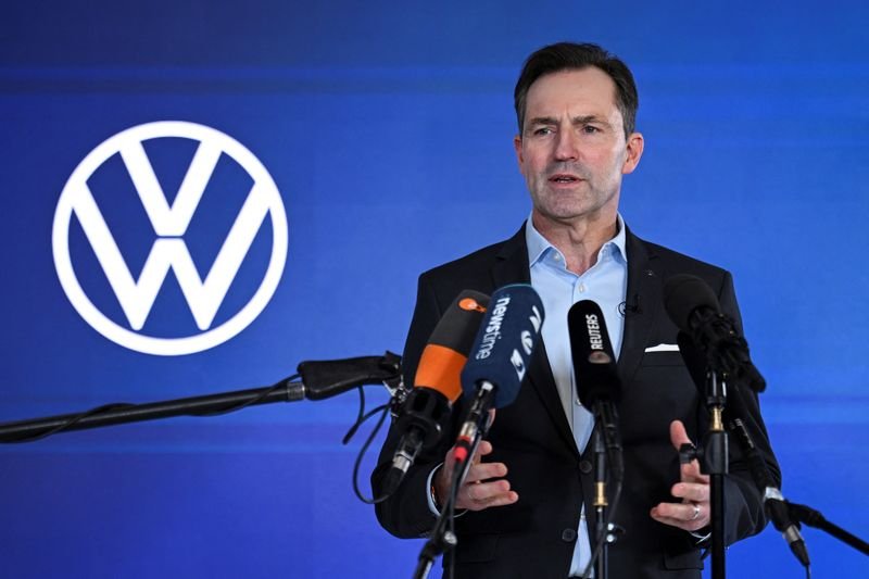 Volkswagen board meeting discussing financial cuts and strategies - Global Banking & Finance Review