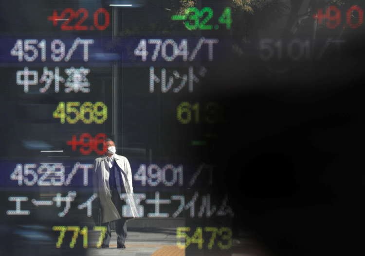 Reflective image of a man in a mask by a stock board, highlighting Japan's banking fees - Global Banking & Finance Review