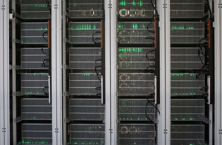 Bitcoin mining computers highlighting environmental impact of cryptocurrency - Global Banking & Finance Review