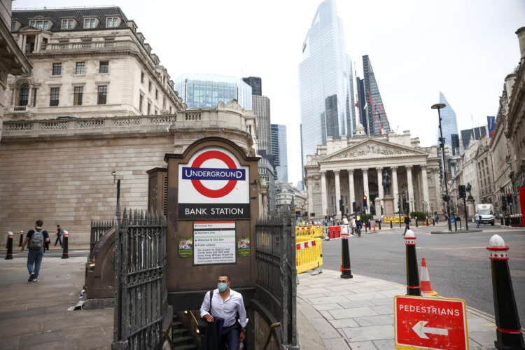 Person exiting Bank underground station in London's financial district - Global Banking & Finance Review