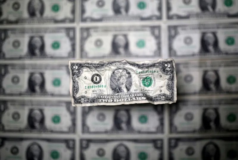 Image for Dollar edges lower, traders focus on data for Fed clues