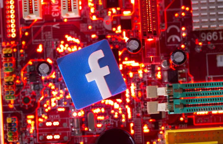 3D printed Facebook logo on a computer motherboard, symbolizing digital competition - Global Banking & Finance Review