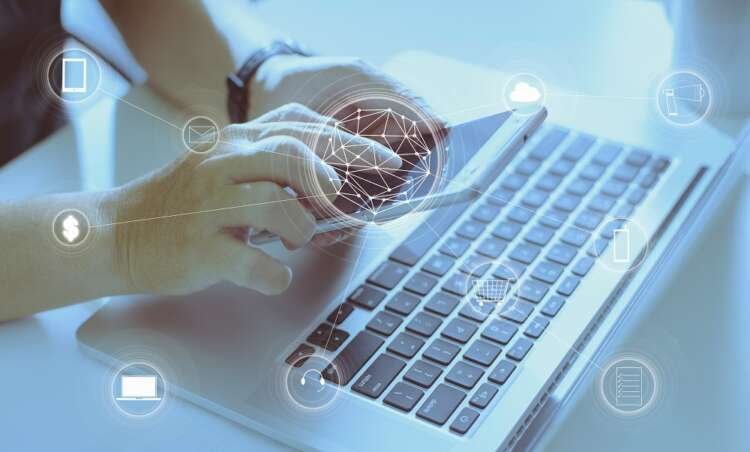 Man using a digital device for online payments, illustrating trends in Asia's financial markets - Global Banking & Finance Review