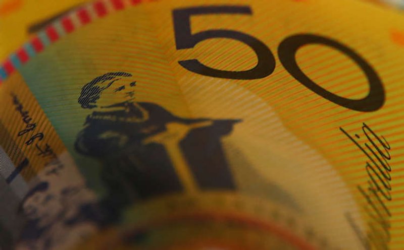 Image for Dollar gains on reflation trade, Aussie recovers
