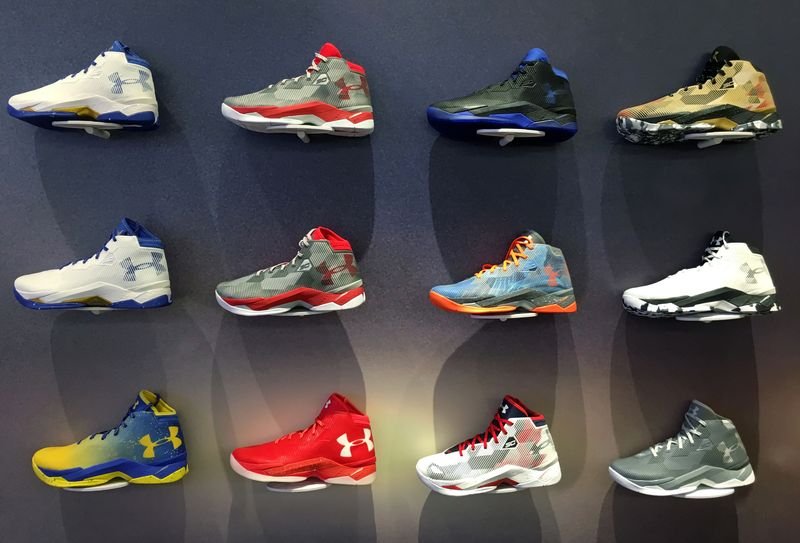 Under Armour logo with a rising stock graph, highlighting CEO Plank's strategy - Global Banking & Finance Review