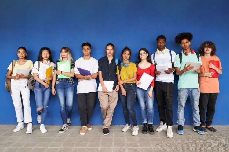 Diverse group of high school students preparing for exams, showcasing the bridge between education and the workplace - Global Banking & Finance Review