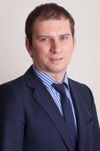 Financial trader analyzing currency charts and market trends - Global Banking & Finance Review