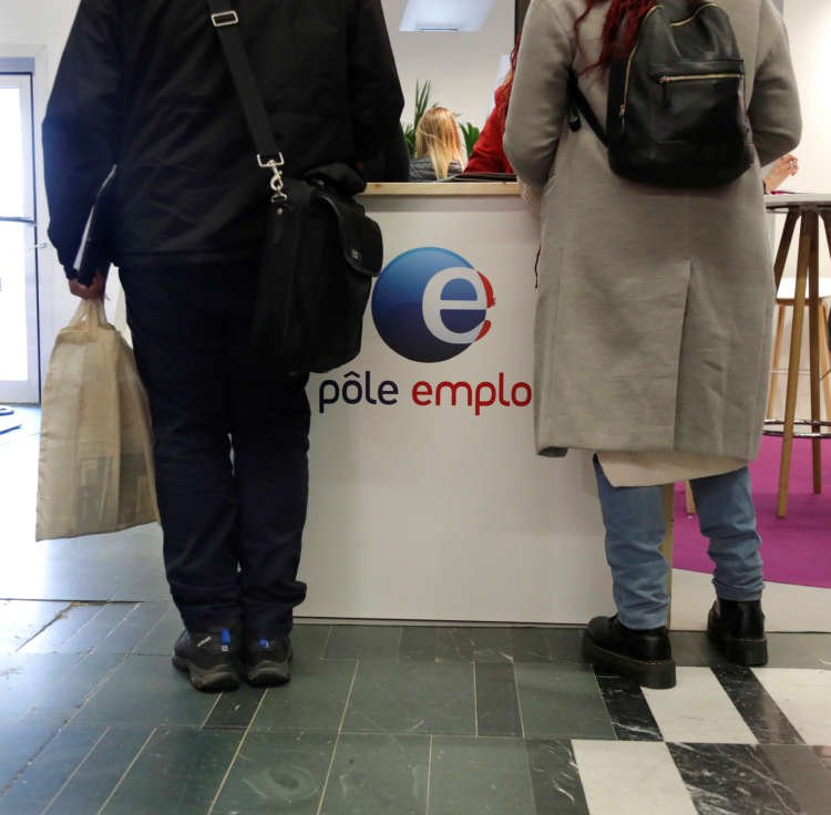 People visit the Pole Emploi (National Agency for Employment) stand at the Young Entrepreneurs fair in Paris