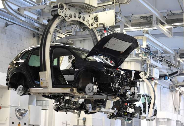 Car production line at Volkswagen, highlighting the semiconductor chip shortage impact - Global Banking & Finance Review