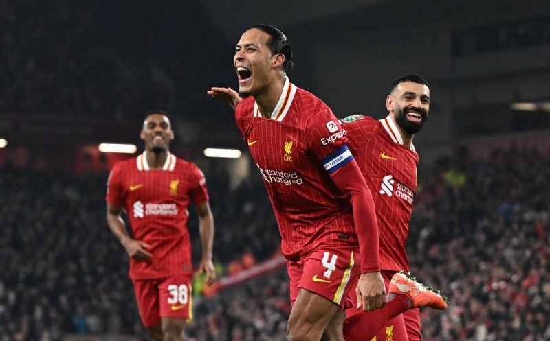 Liverpool players celebrate their 4-0 victory over Spurs in the League Cup match - Global Banking & Finance Review