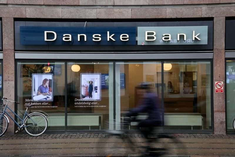 Danske Bank logo and shares graph illustrating 7% rise in stock price - Global Banking & Finance Review