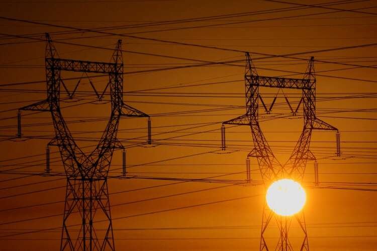 Electrical power pylons against a winter sunset, highlighting France's energy challenges - Global Banking & Finance Review