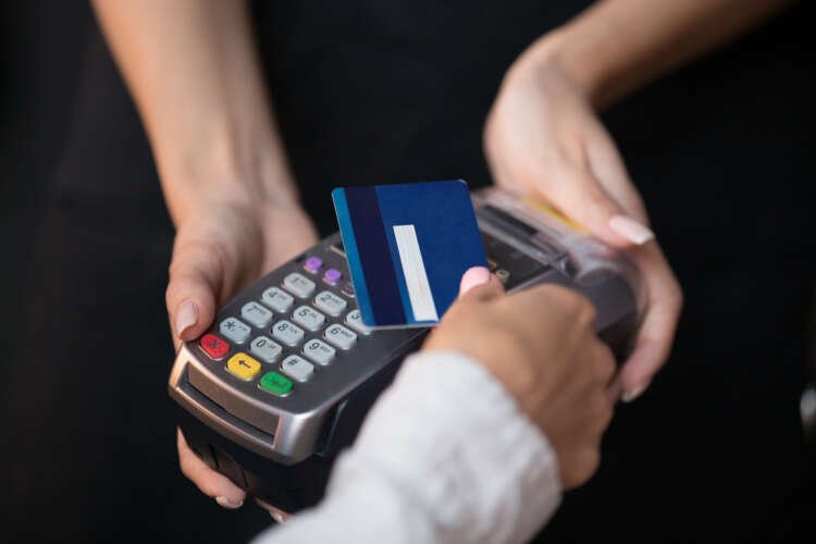 Customer using a contactless biometric payment card for secure transactions - Global Banking & Finance Review