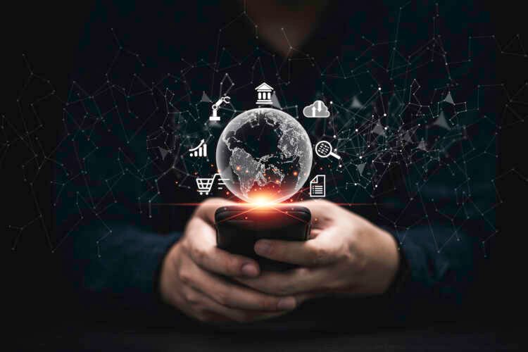 Businessman using smartphone amidst digital finance icons illustrating future banking trends - Global Banking & Finance Review