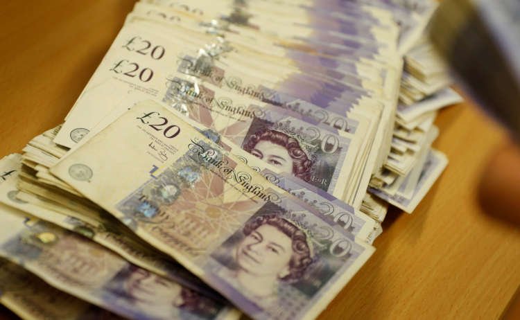 British Pound Sterling banknotes highlighting growth in currency value - Global Banking & Finance Review