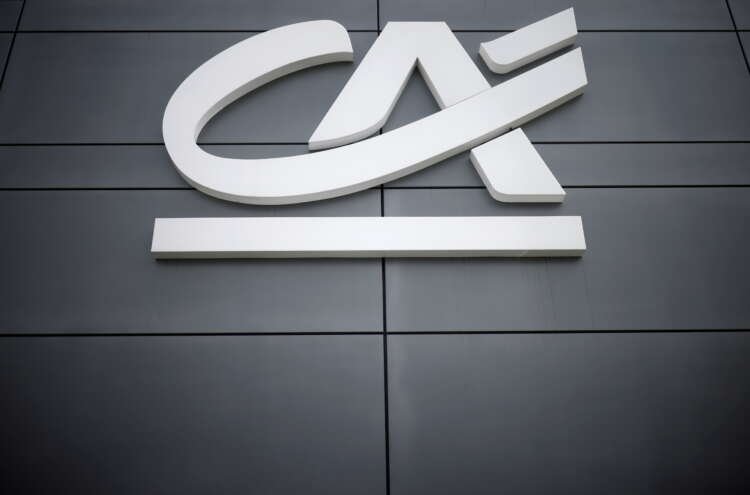 Credit Agricole bank office logo outside a branch in Reze, France - Global Banking & Finance Review