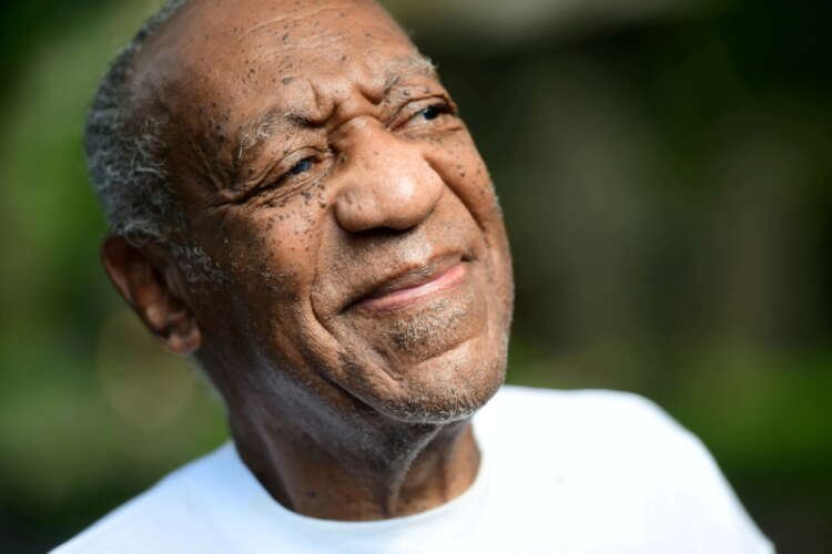 Bill Cosby looks on outside his house after Pennsylvania’s highest court overturned his sexual assault conviction and ordered him released from prison immediately, in Elkins Park